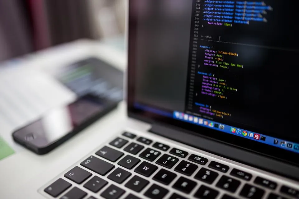 Code open in an editor on a laptop screen