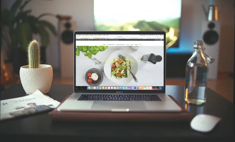 A finished website open on a laptop on a desk